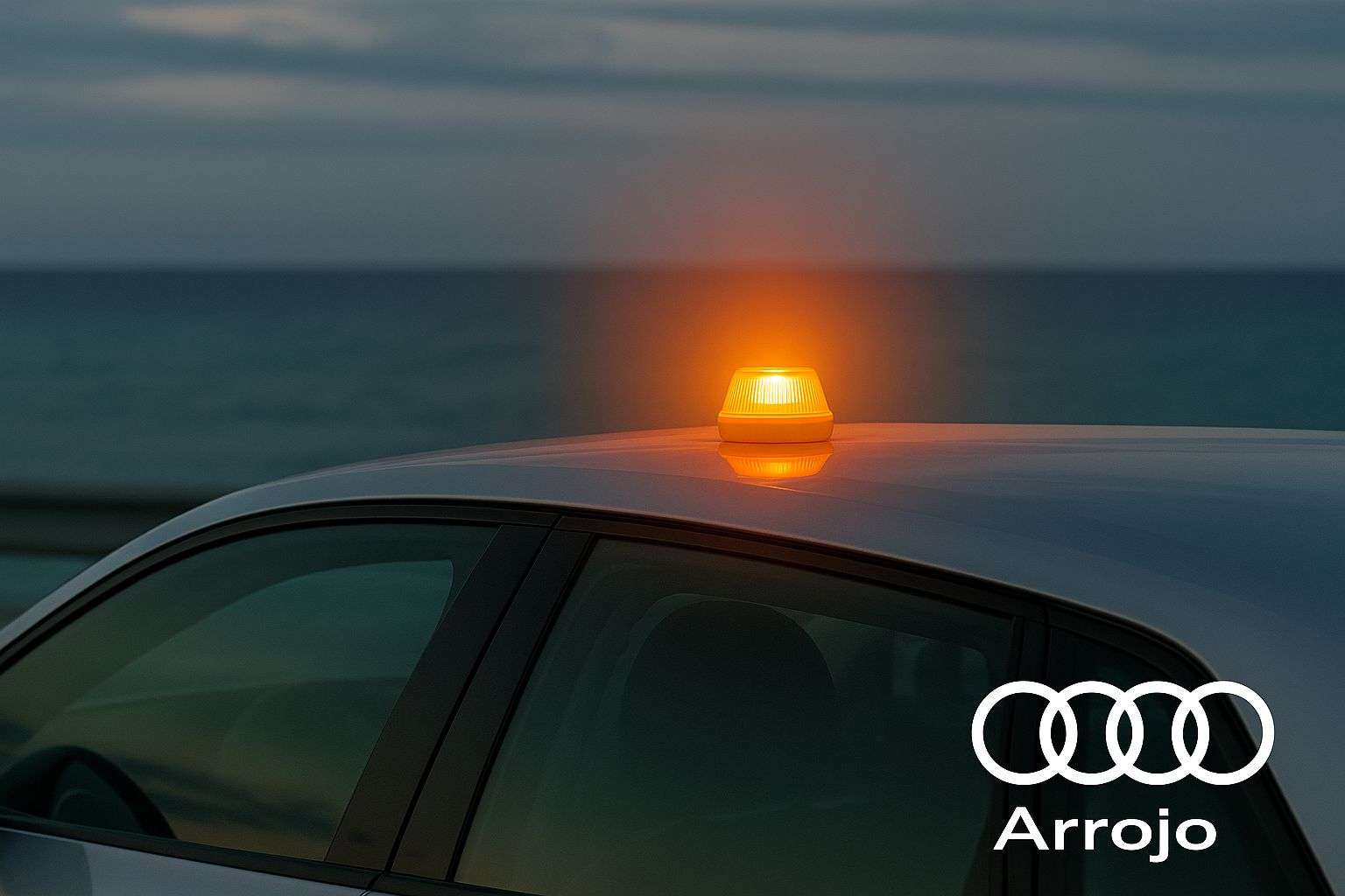 Vista de un audi con la baliza v16 en el techo y el logo de arrojo