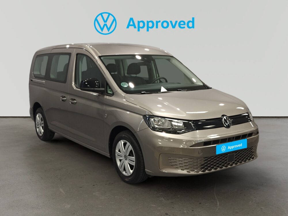 Volkswagen Caddy aprobado beige con insignia azul